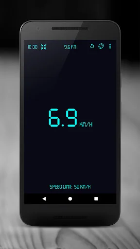 GPS Speedometer showing 6.9 km/h in cyan digital display with 50 km/h speed limit indicator on dark screen
