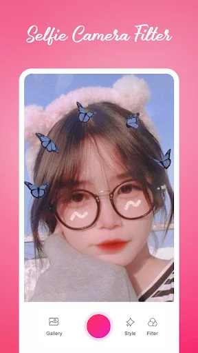 Selfie camera showing butterfly filter overlay on portrait with heart-shaped glasses and beauty effects